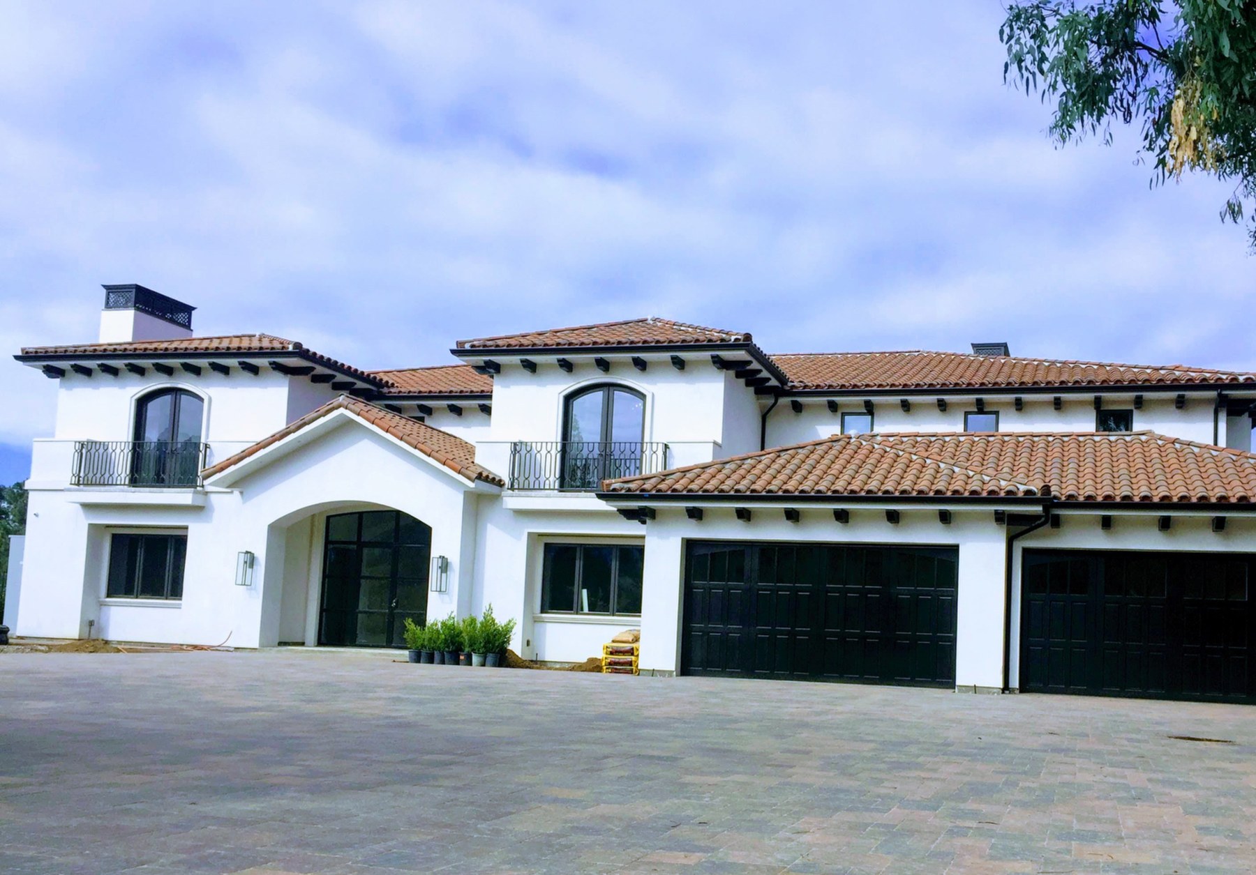Completed white stucco home by Southwest Stucco